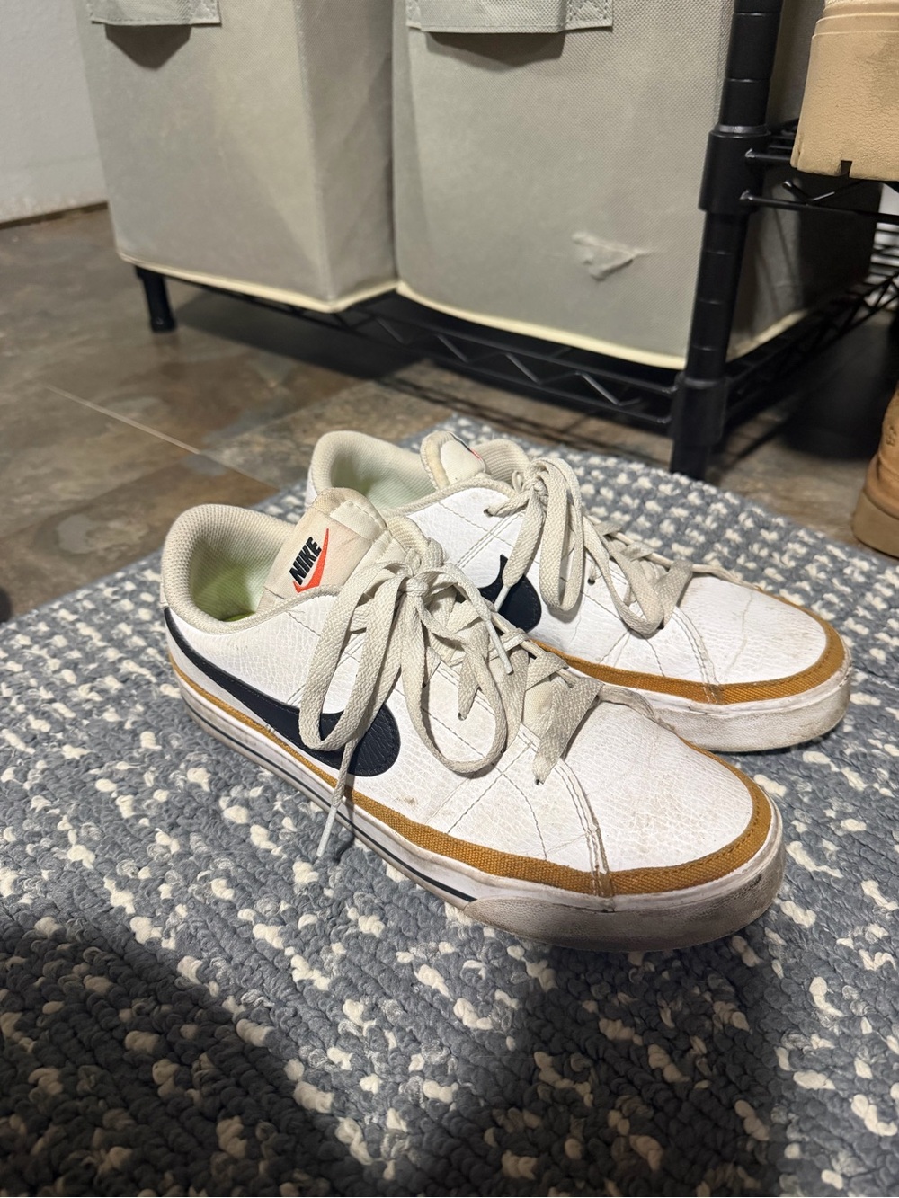 Nike Woman’s White Sneakers with Navy Swoosh and Tan Trim